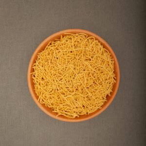 Omapodi sev in a bowl, traditional South Indian snack.