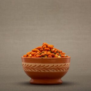 Masala peanuts in a bowl with red chili garnish.